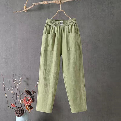 Straight-cut trousers with an elastic waistband and a simple design