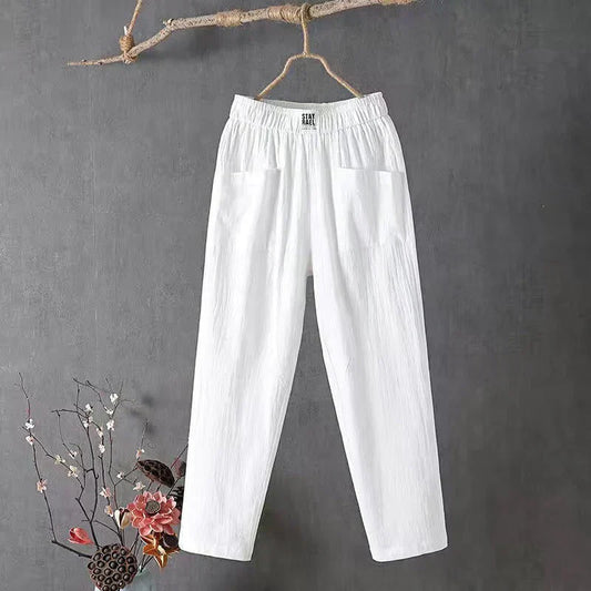 Straight-cut trousers with an elastic waistband and a simple design