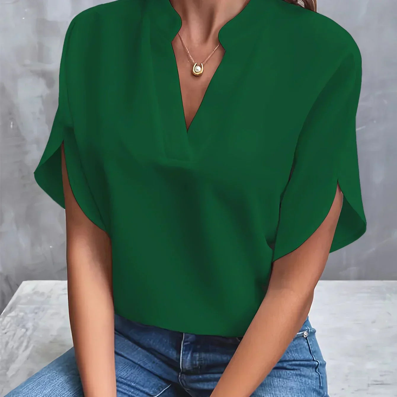 Short-sleeved top with V-neck and loose cut